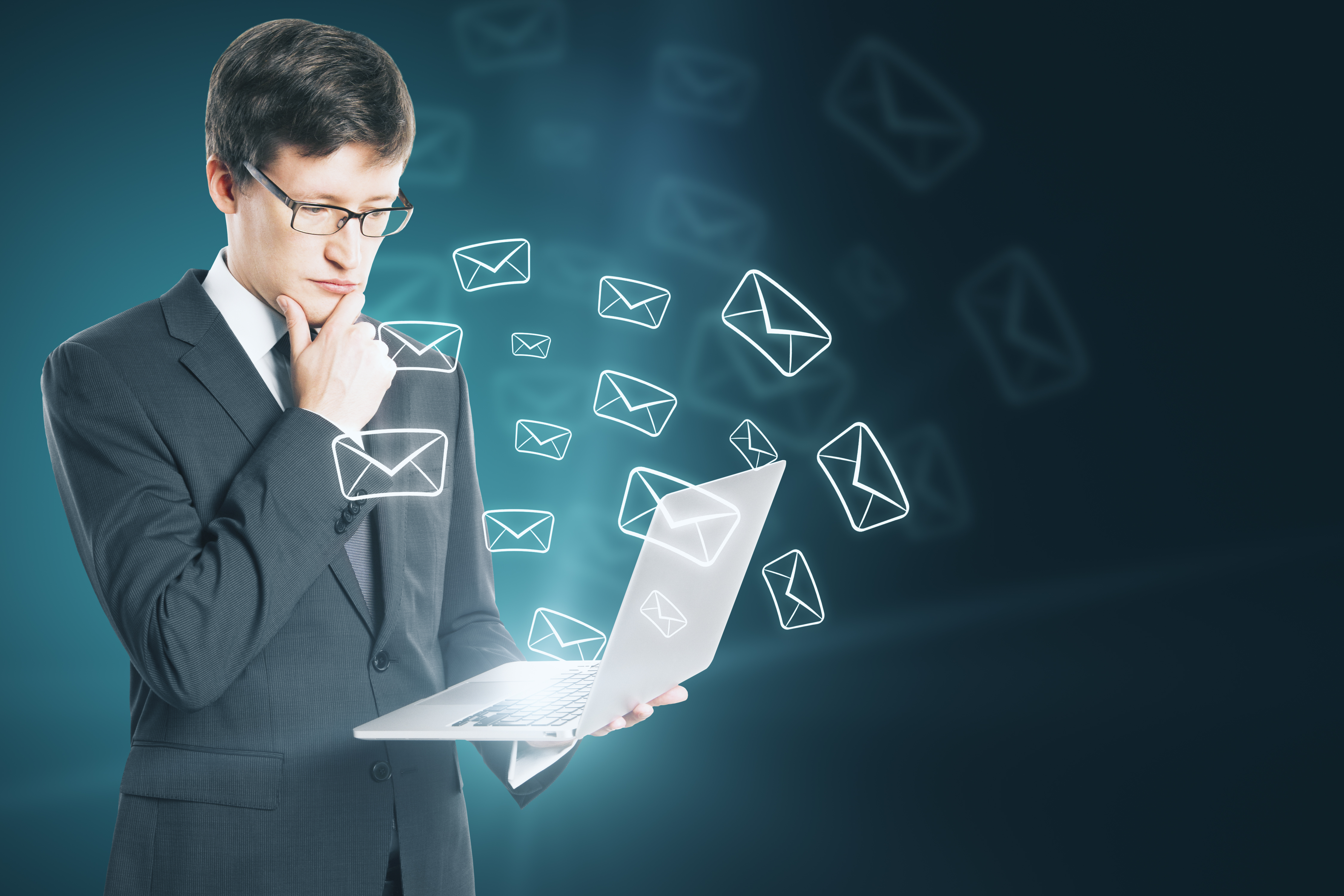Businessman hand holding laptop with glowing email network. E-mail marketing, message and communication concept. Multiex
